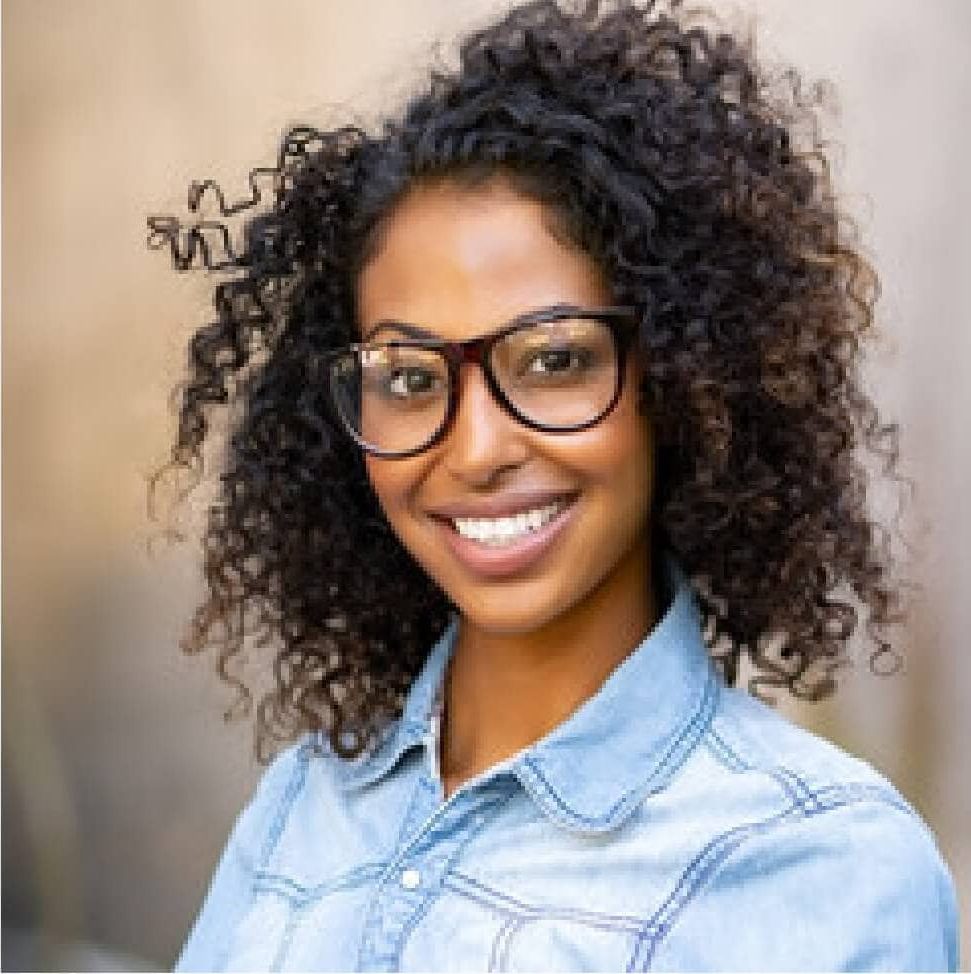 curly haired girl wearing glasses